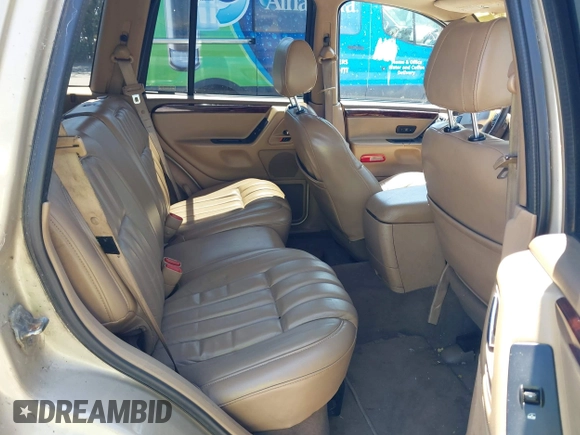 2000 Jeep Grand Cherokee Laredo z VIN 1J4G258S5YC237373, wystawiony jako IAAI lot #42736569 z przebiegiem 103 310 mil mil oraz . Historia ofert i sprzedaży dostępna na DreamBid. Obrazek 8.