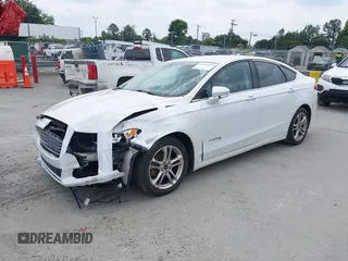 2015 Ford Fusion SE Hybrid with VIN 3FA6P0LU2FR305597, listed as a IAAI auction lot 42168292 with 97,688 mi miles and . Bid and sale history available at DreamBid. Image 2.