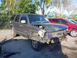2001 Chevrolet Tahoe LS z VIN 1GNEC13T11R182692, wystawiony jako IAAI lot #41511354 z przebiegiem 293 614 mil mil oraz . Historia ofert i sprzedaży dostępna na DreamBid. Obrazek 1.