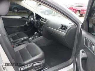 2015 Volkswagen Jetta Sedan 1.8T SE with VIN 3VWD17AJ4FM302117, listed as a IAAI auction lot 41917138 with 122,946 mi miles. Bid and sale history available at carsss.com. Image 5.