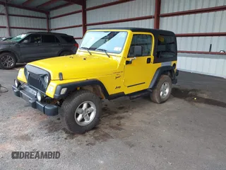 2001 Jeep Wrangler Sport with VIN 1J4FA49S81P370778, listed as a IAAI auction lot 42715015 with 123,259 mi miles and . Bid and sale history available at DreamBid. Image 2.