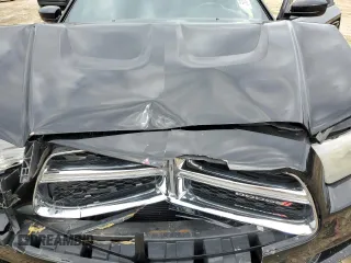 2013 Dodge Charger SE z VIN 2C3CDXBG3DH566891, wystawiony jako Copart lot #50501075 z przebiegiem 176 024 mil mil oraz Szkody całkowita. Historia ofert i sprzedaży dostępna na DreamBid. Obrazek 13.
