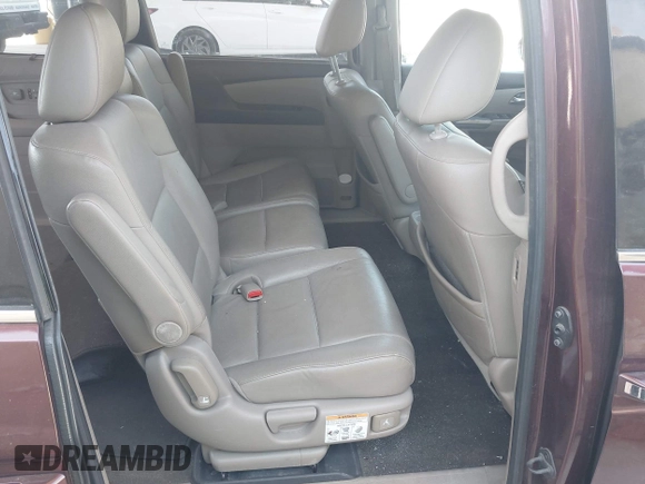 2014 Honda Odyssey Touring with VIN 5FNRL5H90EB080889, listed as a IAAI auction lot 42085305 with 123,286 mi miles and . Bid and sale history available at carsss.com. Image 8.