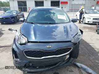 2020 Kia Sportage LX with VIN KNDPM3AC3L7713581, listed as a IAAI auction lot 40255286 with 90,221 mi miles and . Bid and sale history available at carsss.com. Image 11.