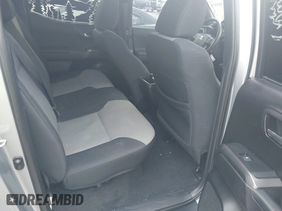 2021 Toyota Tacoma SR z VIN 3TMCZ5AN0MM386867, wystawiony jako IAAI lot #41580426 z przebiegiem 46 559 mil mil oraz . Historia ofert i sprzedaży dostępna na DreamBid. Obrazek 8.