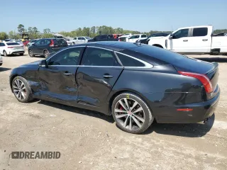 2013 Jaguar XJ with VIN SAJWA3HE9DMV49768, listed as a Copart auction lot 50339955 with 56,841 mi miles and Salvage Title. Bid and sale history available at DreamBid. Image 2.
