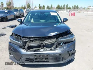 2023 Honda Civic Sedan Touring with VIN 2HGFE1F91PH310656, listed as a IAAI auction lot 41884334 with 17,691 mi miles. Bid and sale history available at carsss.com. Image 13.