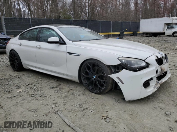 2014 BMW 6 Series 650i xDrive z VIN WBA6B4C54ED371324, wystawiony jako Copart lot #49016325 z przebiegiem 113 395 mil mil oraz Szkoda całkowita • Salvage title. Historia ofert i sprzedaży dostępna na DreamBid. Obrazek 4.