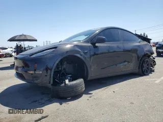 2024 Tesla Model Y Long Range z VIN 7SAYGDEE0RF123793, wystawiony jako Copart lot #57177305 z przebiegiem 20 053 mil mil oraz Szkoda całkowita • Salvage title. Historia ofert i sprzedaży dostępna na DreamBid. Obrazek 1.