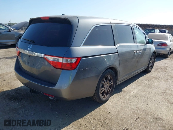 2012 Honda Odyssey EX-L with VIN 5FNRL5H6XCB061026, listed as a IAAI auction lot 42574612 with 144,480 mi miles and . Bid and sale history available at DreamBid. Image 4.