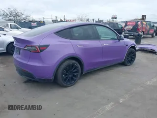 2021 Tesla Model Y Long Range with VIN 5YJYGDEE7MF224531, listed as a IAAI auction lot 38454442 with 52,408 mi miles. Bid and sale history available at carsss.com. Image 4.