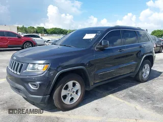2014 Jeep Grand Cherokee Laredo with VIN 1C4RJEAG0EC179563, listed as a IAAI auction lot 39799427 with 209,169 mi miles and . Bid and sale history available at DreamBid. Image 2.