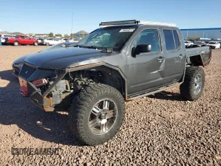 2010 Nissan Frontier Pro-4X z VIN 1N6AD0EV1AC401809, wystawiony jako Copart lot #50530915 z przebiegiem Nie podano mil oraz Szkoda całkowita • Salvage title. Historia ofert i sprzedaży dostępna na DreamBid. Obrazek 1.