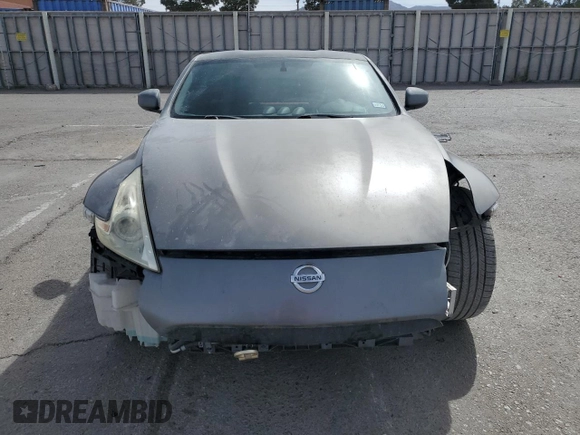 2014 Nissan 370Z z VIN JN1AZ4EH0EM630751, wystawiony jako Copart lot #51489825 z przebiegiem 125 107 mil mil oraz Czysty tytuł • Clean title. Historia ofert i sprzedaży dostępna na DreamBid. Obrazek 5.