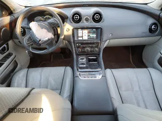 2014 Jaguar XJ Portfolio with VIN SAJWJ2GD5E8V69562, listed as a Copart auction lot 87737195 with 100,525 mi miles and Salvage title. Bid and sale history available at DreamBid. Image 8.