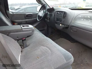 2000 Ford F-150 XL with VIN 1FTRX18LXYNA76850, listed as a IAAI auction lot 41384438 with 167,471 mi miles. Bid and sale history available at carsss.com. Image 5.