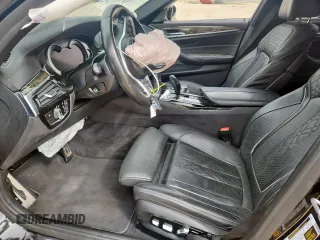 2018 BMW 5 Series 540i xDrive with VIN WBAJE7C52JWD52730, listed as a Copart auction lot 60297425 with 104,208 mi miles and Salvage title. Bid and sale history available at DreamBid. Image 7.