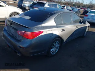 2015 Infiniti Q50 Premium z VIN JN1BV7AR2FM423666, wystawiony jako IAAI lot #41345228 z przebiegiem 67 027 mil mil oraz . Historia ofert i sprzedaży dostępna na DreamBid. Obrazek 4.