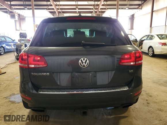 2014 Volkswagen Touareg Lux z VIN WVGEF9BP9ED014963, wystawiony jako Copart lot #50555345 z przebiegiem 153 907 mil mil oraz Szkoda całkowita • Salvage title. Historia ofert i sprzedaży dostępna na DreamBid. Obrazek 6.