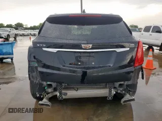 2017 Cadillac XT5 Luxury FWD z VIN 1GYKNBRS9HZ160664, wystawiony jako Copart lot #55856915 z przebiegiem 98 161 mil mil oraz Szkody całkowita. Historia ofert i sprzedaży dostępna na DreamBid. Obrazek 6.