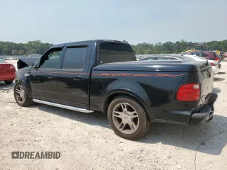 2002 Ford F-150 Harley Davidson with VIN 1FTRW07312KC64714, listed as a Copart auction lot 51275124 with 198,826 mi miles and Non Repairable. Bid and sale history available at carsss.com. Image 2.