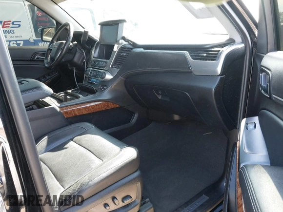 2019 Chevrolet Suburban LT with VIN 1GNSCJKCXKR332739, listed as a IAAI auction lot 41636530 with 104,997 mi miles and . Bid and sale history available at DreamBid. Image 5.
