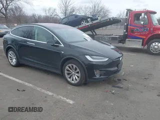 2019 Tesla Model X 75D with VIN 5YJXCDE21KF156446, listed as a IAAI auction lot 41726220 with 73,027 mi miles. Bid and sale history available at carsss.com. Image 1.