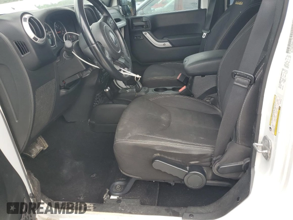 2014 Jeep Wrangler Unlimited Sahara with VIN 1C4BJWEG8EL266340, listed as a Copart auction lot 57809465 with 121,191 mi miles and Salvage title. Bid and sale history available at DreamBid. Image 7.