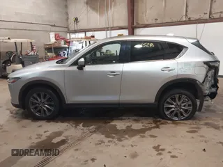 2021 Mazda CX-5 Grand Touring with VIN JM3KFADMXM1318015, listed as a IAAI auction lot 41221528 with 79,473 mi miles. Bid and sale history available at carsss.com. Image 14.