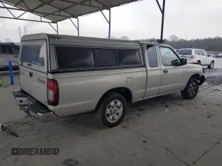 1999 Nissan Frontier XE with VIN 1N6DD26SXXC344449, listed as a Copart auction lot 43748015 with 137,318 mi miles and Salvage title. Bid and sale history available at DreamBid. Image 3.