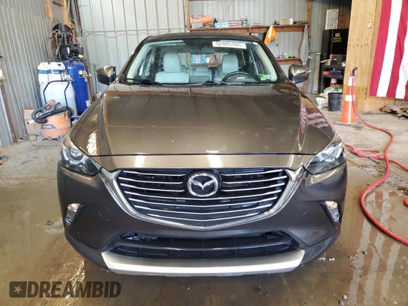 2016 Mazda CX-3 Grand Touring z VIN JM1DKFD74G0137815, wystawiony jako Copart lot #52405765 z przebiegiem 128 922 mil mil oraz Szkoda całkowita • Salvage title. Historia ofert i sprzedaży dostępna na DreamBid. Obrazek 5.