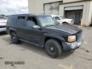 1999 GMC Denali z VIN 1GKEK13R1XR917376, wystawiony jako Copart lot #64991924 z przebiegiem 247 231 mil mil oraz Tytuł czysty. Historia ofert i sprzedaży dostępna na DreamBid. Obrazek 4.