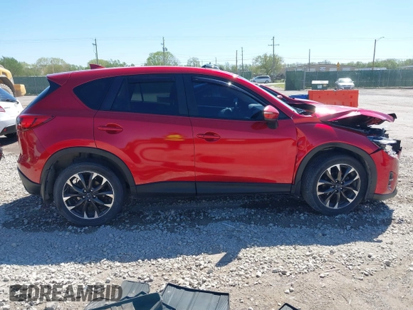 2016 Mazda CX-5 Grand Touring with VIN JM3KE2DYXG0652017, listed as a IAAI auction lot 42041158 with 95,946 mi miles and . Bid and sale history available at DreamBid. Image 13.