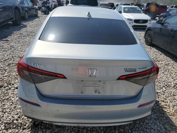 2023 Honda Civic Touring z VIN 2HGFE1F94PH310134, wystawiony jako Copart lot #52311085 z przebiegiem 32 682 mil mil oraz Szkoda całkowita • Salvage title. Historia ofert i sprzedaży dostępna na DreamBid. Obrazek 6.