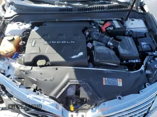 2015 Lincoln MKZ z VIN 3LN6L2GK8FR627120, wystawiony jako Copart lot #45954315 z przebiegiem 103 930 mil mil oraz Szkoda całkowita • Salvage title. Historia ofert i sprzedaży dostępna na DreamBid. Obrazek 12.