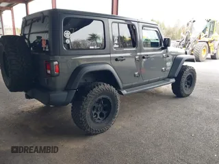 2021 Jeep Wrangler Unlimited Sport S z VIN 1C4HJXDG2MW542087, wystawiony jako IAAI lot #41893734 z przebiegiem 57 000 mil mil oraz . Historia ofert i sprzedaży dostępna na DreamBid. Obrazek 4.