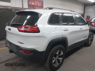 2015 Jeep Cherokee Trailhawk with VIN 1C4PJMBS1FW665500, listed as a IAAI auction lot 42068268 with 127,246 mi miles. Bid and sale history available at carsss.com. Image 4.