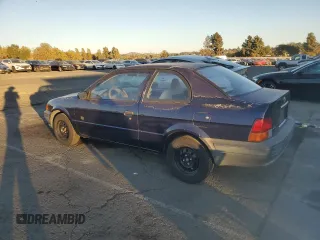 1996 Toyota Tercel DX z VIN JT2AC52L5T0190097, wystawiony jako Copart lot #76574844 z przebiegiem 175 256 mil mil oraz Tytuł czysty. Historia ofert i sprzedaży dostępna na DreamBid. Obrazek 2.