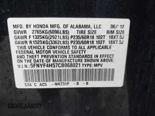 2012 Honda Pilot EX-L with VIN 5FNYF4H57CB068021, listed as a IAAI auction lot 41909996 with 253,542 mi miles and . Bid and sale history available at carsss.com. Image 9.