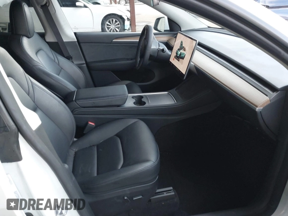 2023 Tesla Model Y Long Range with VIN 7SAYGAEE0PF787216, listed as a IAAI auction lot 41589954 with 17,985 mi miles and . Bid and sale history available at DreamBid. Image 5.