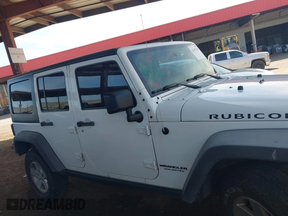 2015 Jeep Wrangler Unlimited Rubicon with VIN 1C4BJWFG9FL744927, listed as a IAAI auction lot 42169740 with 106,352 mi miles and . Bid and sale history available at DreamBid. Image 14.