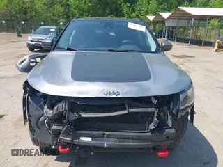 2021 Jeep Compass Trailhawk z VIN 3C4NJDDB7MT590390, wystawiony jako IAAI lot #42163205 z przebiegiem 70 551 mil mil oraz . Historia ofert i sprzedaży dostępna na DreamBid. Obrazek 13.