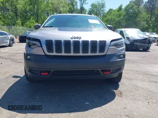 2020 Jeep Cherokee Trailhawk z VIN 1C4PJMBX1LD590087, wystawiony jako IAAI lot #42027620 z przebiegiem 91 033 mil mil oraz . Historia ofert i sprzedaży dostępna na DreamBid. Obrazek 12.