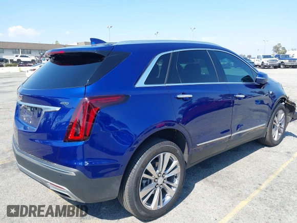 2023 Cadillac XT5 FWD Premium Luxury z VIN 1GYKNCRS3PZ176654, wystawiony jako IAAI lot #42136259 z przebiegiem 20 403 mil mil oraz . Historia ofert i sprzedaży dostępna na DreamBid. Obrazek 4.