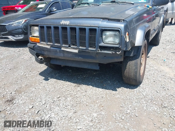 2001 Jeep Cherokee Sport z VIN 1J4FF48S71L572604, wystawiony jako IAAI lot #42817599 z przebiegiem 212 774 mil mil oraz . Historia ofert i sprzedaży dostępna na DreamBid. Obrazek 6.