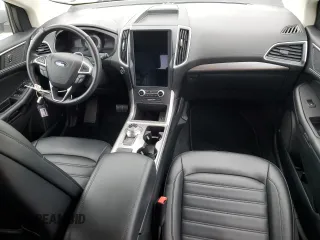 2023 Ford Edge SEL z VIN 2FMPK4J90PBA38667, wystawiony jako Copart lot #87404284 z przebiegiem Nie podano mil oraz Szkoda całkowita • Salvage title. Historia ofert i sprzedaży dostępna na DreamBid. Obrazek 8.