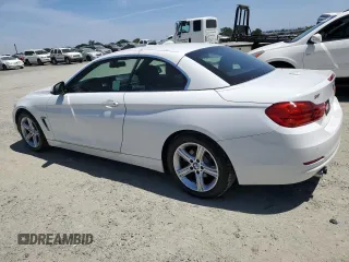 2015 BMW 4 Series 428i with VIN WBA3V7C59FP771861, listed as a Copart auction lot 56562525 with 64,273 mi miles and Salvage title. Bid and sale history available at DreamBid. Image 2.