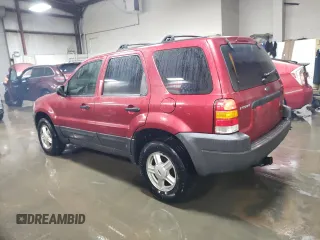 2004 Ford Escape XLS with VIN 1FMYU021X4DA05312, listed as a Copart auction lot 86185954 with 186,010 mi miles and Salvage Title. Bid and sale history available at DreamBid. Image 2.