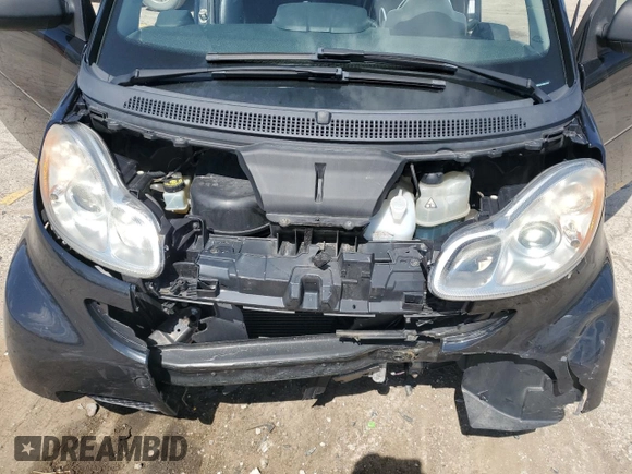 2009 Smart fortwo Pure z VIN WMEEJ31X49K219479, wystawiony jako Copart lot #52446625 z przebiegiem 82 337 mil mil oraz Szkody całkowita. Historia ofert i sprzedaży dostępna na DreamBid. Obrazek 13.