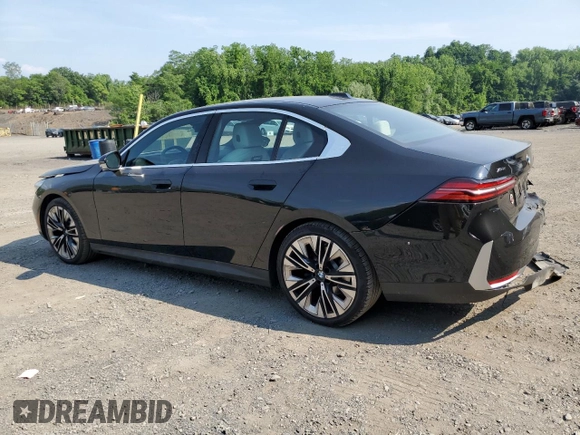 2024 BMW 5 Series 530i xDrive with VIN WBA53FJ04RCP87607, listed as a Copart auction lot 58768065 with 11,596 mi miles and Salvage title. Bid and sale history available at DreamBid. Image 2.